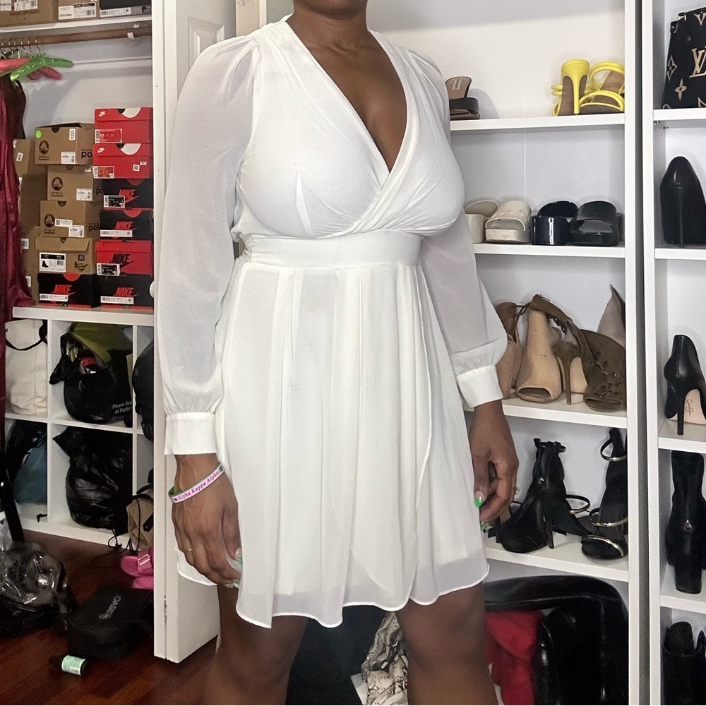 White semi formal dress with open back concept.